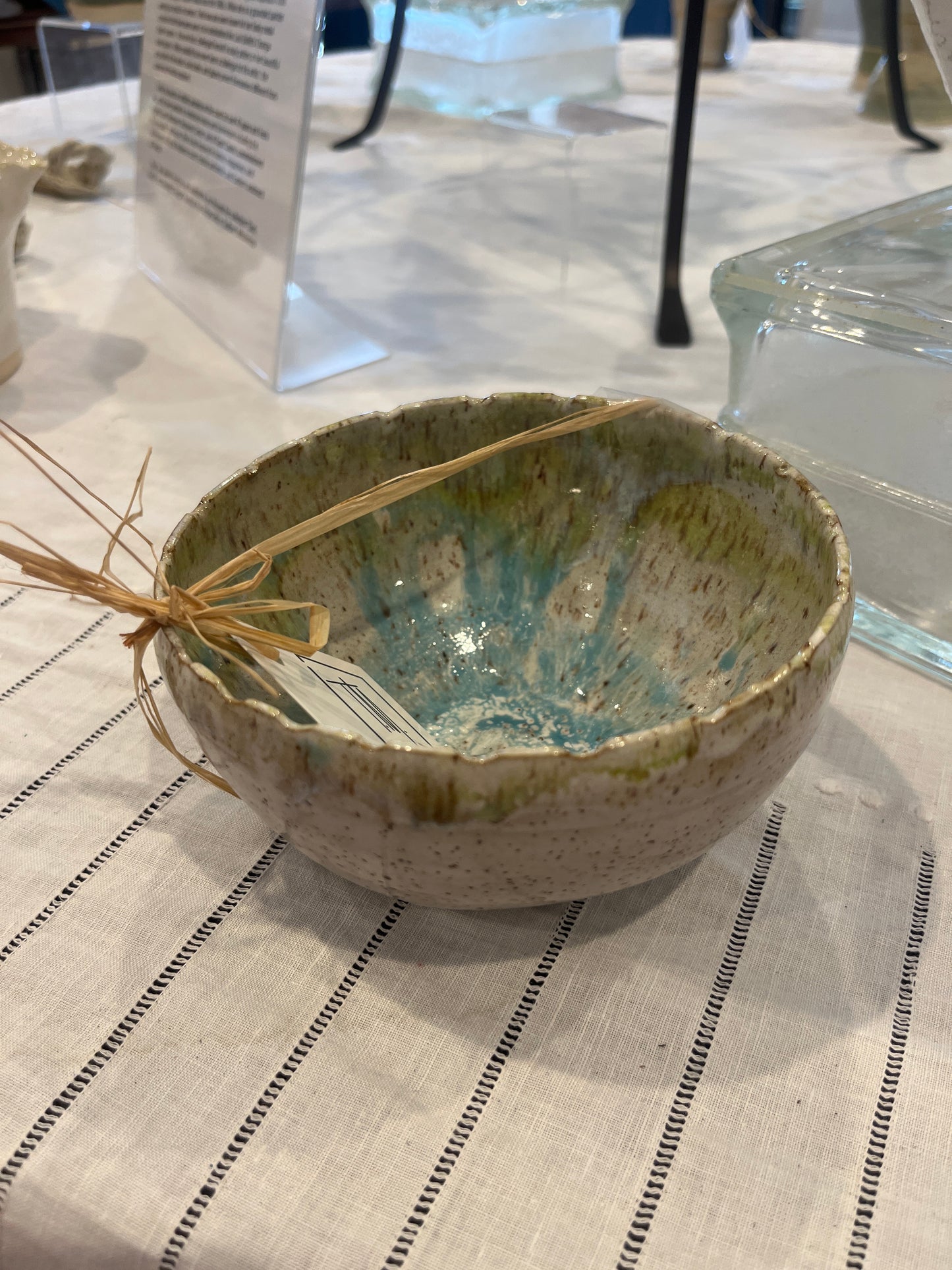 Tehle McGuffee #167 Small white speckled bowl with blue and green inside